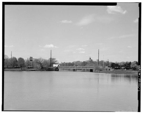 Black-and-white view west across the Cooper River toward the Route 130 bridge.