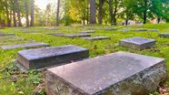 Flat Moravian headstones in the grass at God's Acre in Bethlehem
