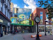 The Crayola Experience building on Centre Square in Easton, with a street clock out front